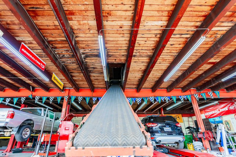 An image of a conveyor belt used for transporting tools and equipments needed for general vehicle maintenance