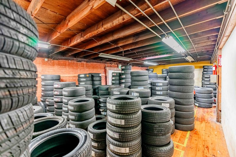 A stack of tires safely stored at Pitt Stop Auto
