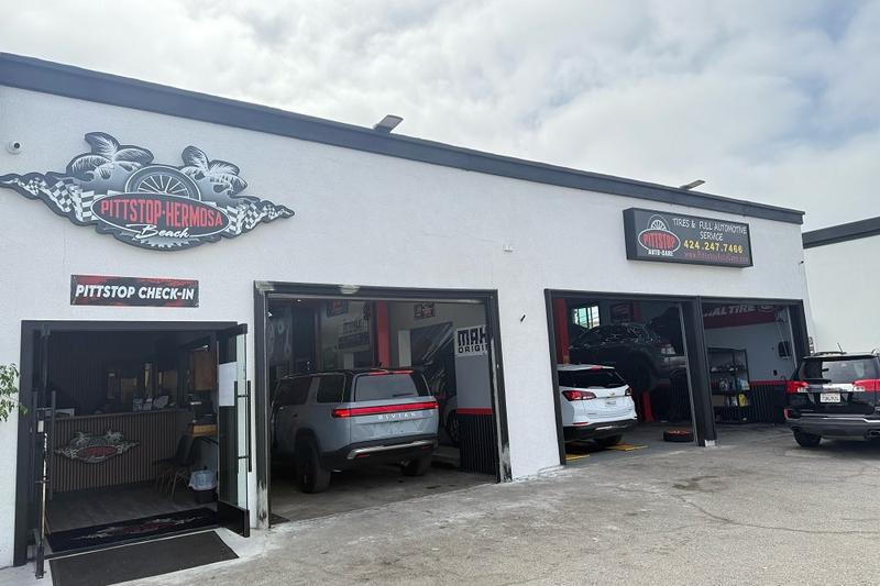 Cars undergoing maintenance at Pitt Stop Auto