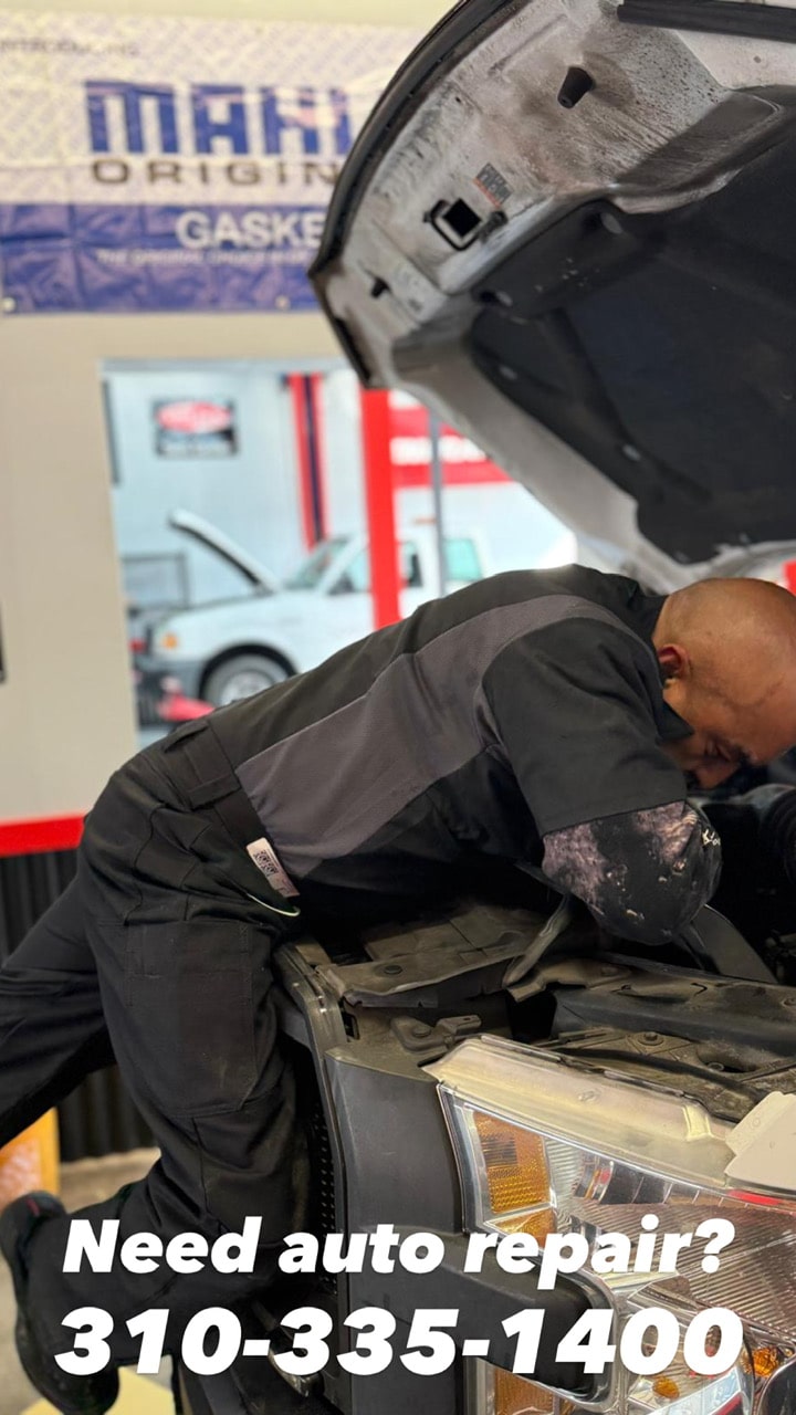 Expert mechanic conducting general vehicle repairs of car