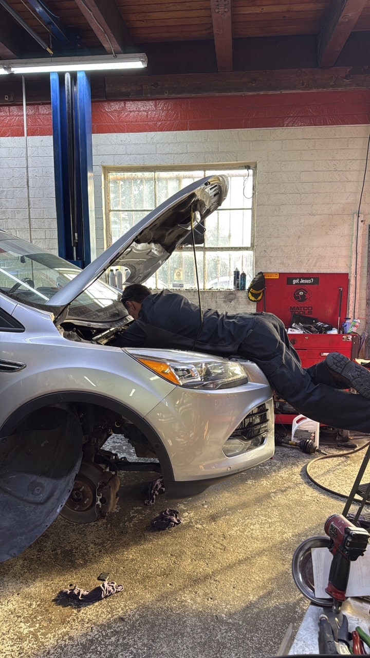 Skilled mechanic conducting engine repairs